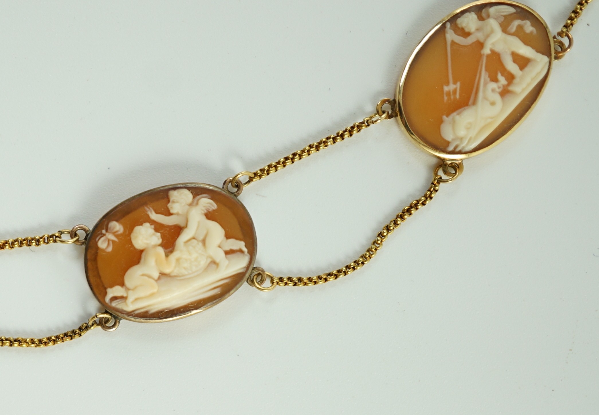 A late Victorian gold and graduated oval cameo shell necklace